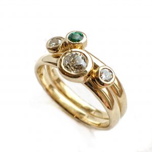 Diamond, emerald and gold stacking rings