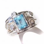 Handmade ring with blue topaz and diamonds