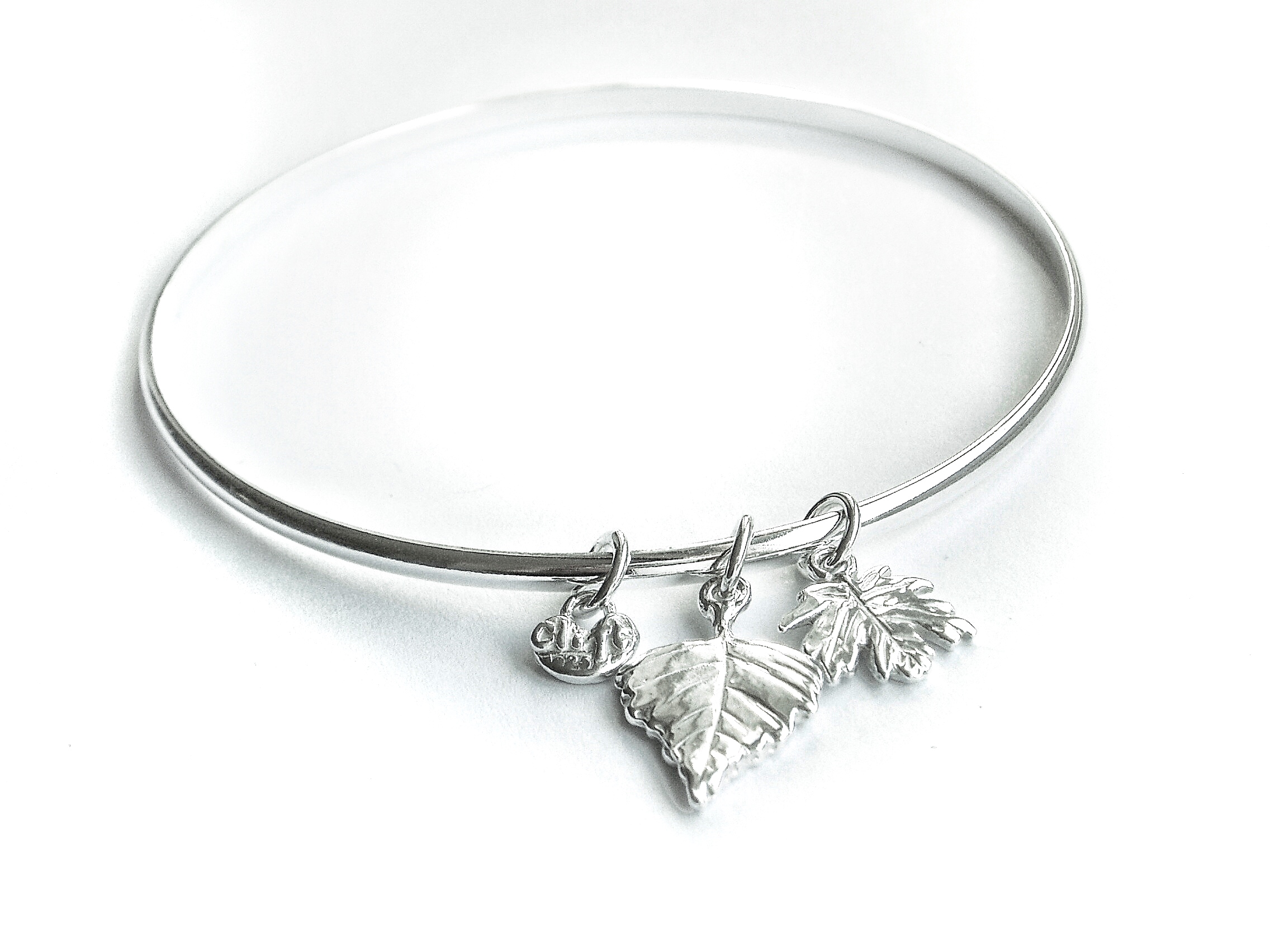 Handmade silver bangle with two leaves - Carol Clift Jewellery