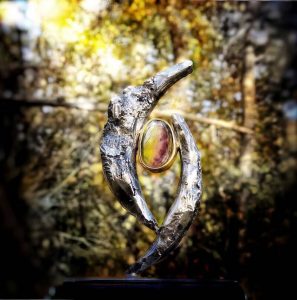 Mystical sculpture with engraving 'What are you looking for'